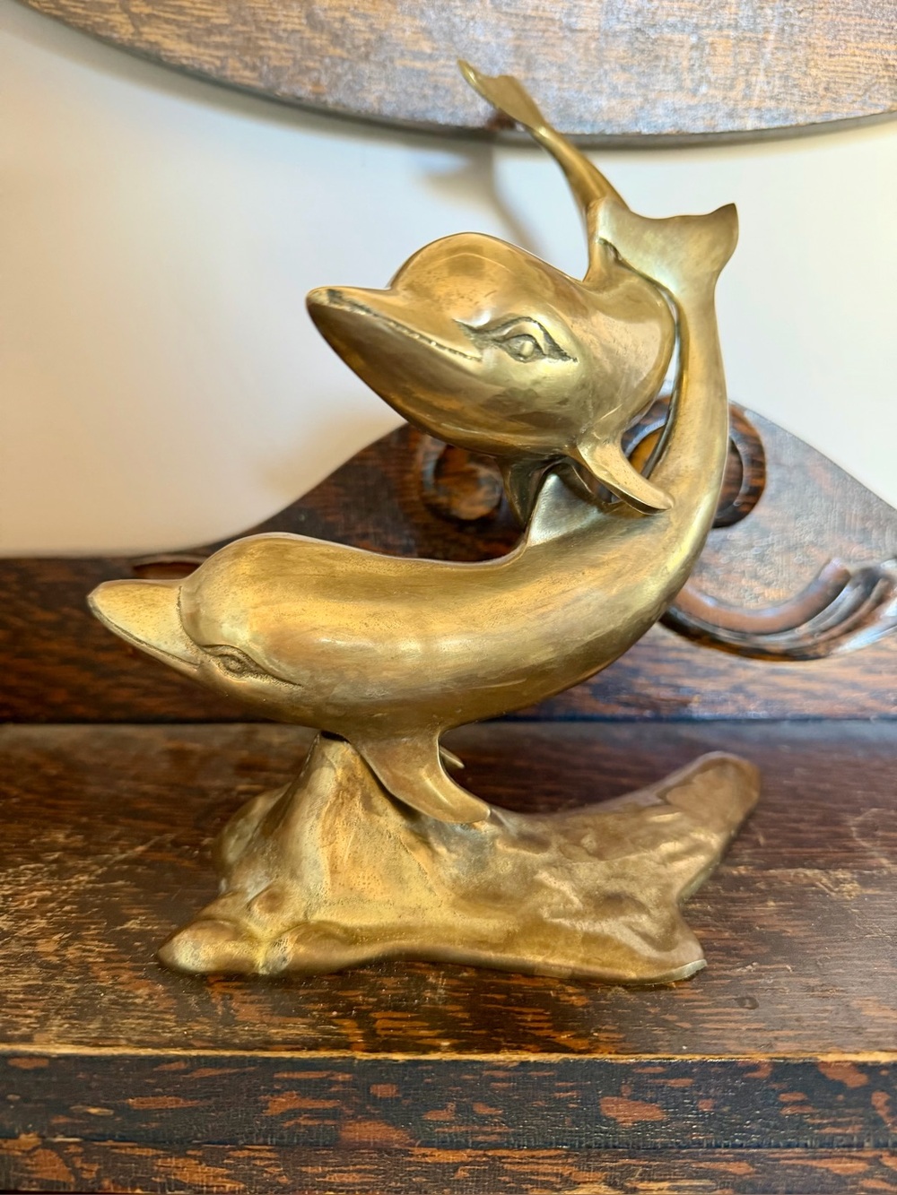 Vintage brass dolphins